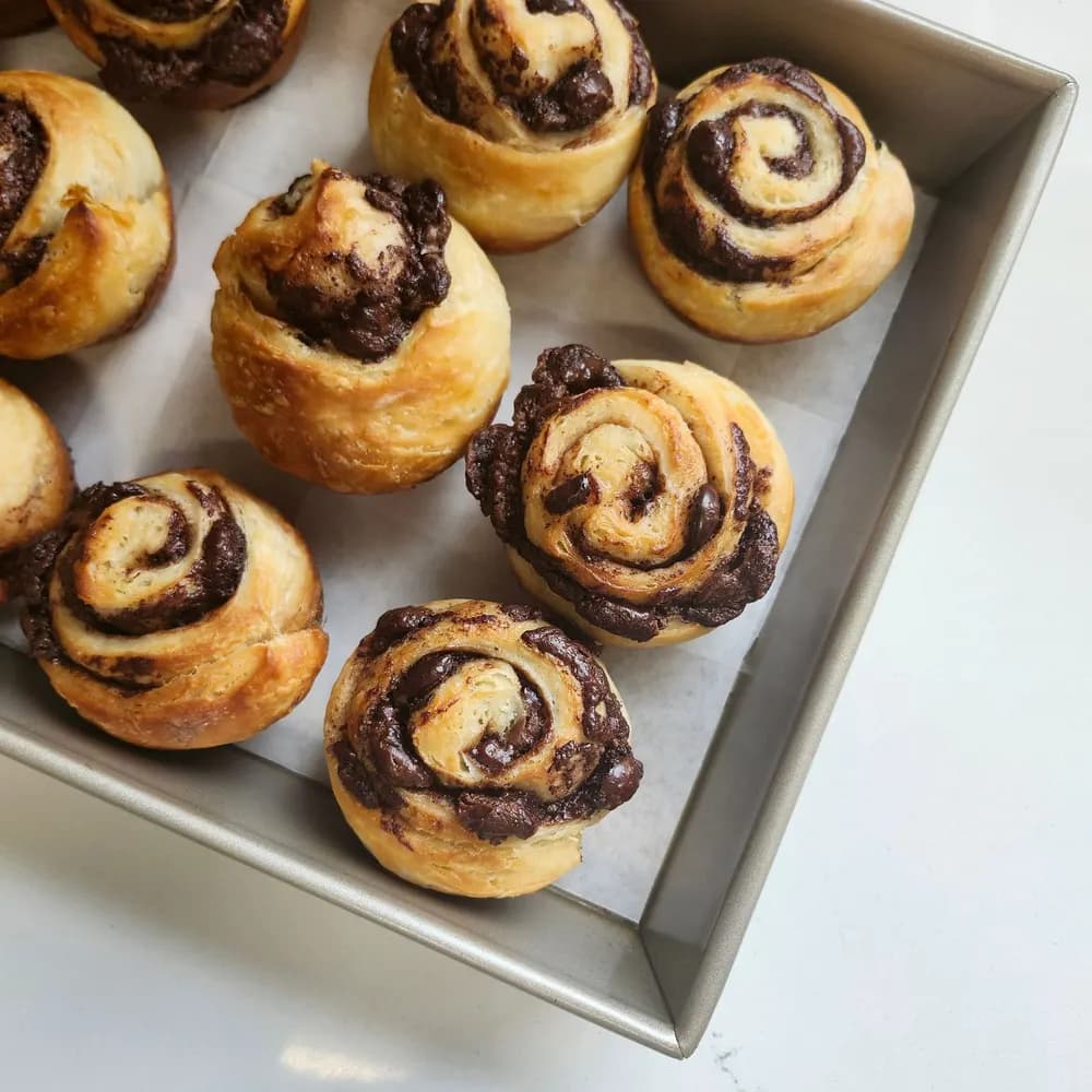 Tray of freshly baked chocolate swirl buns